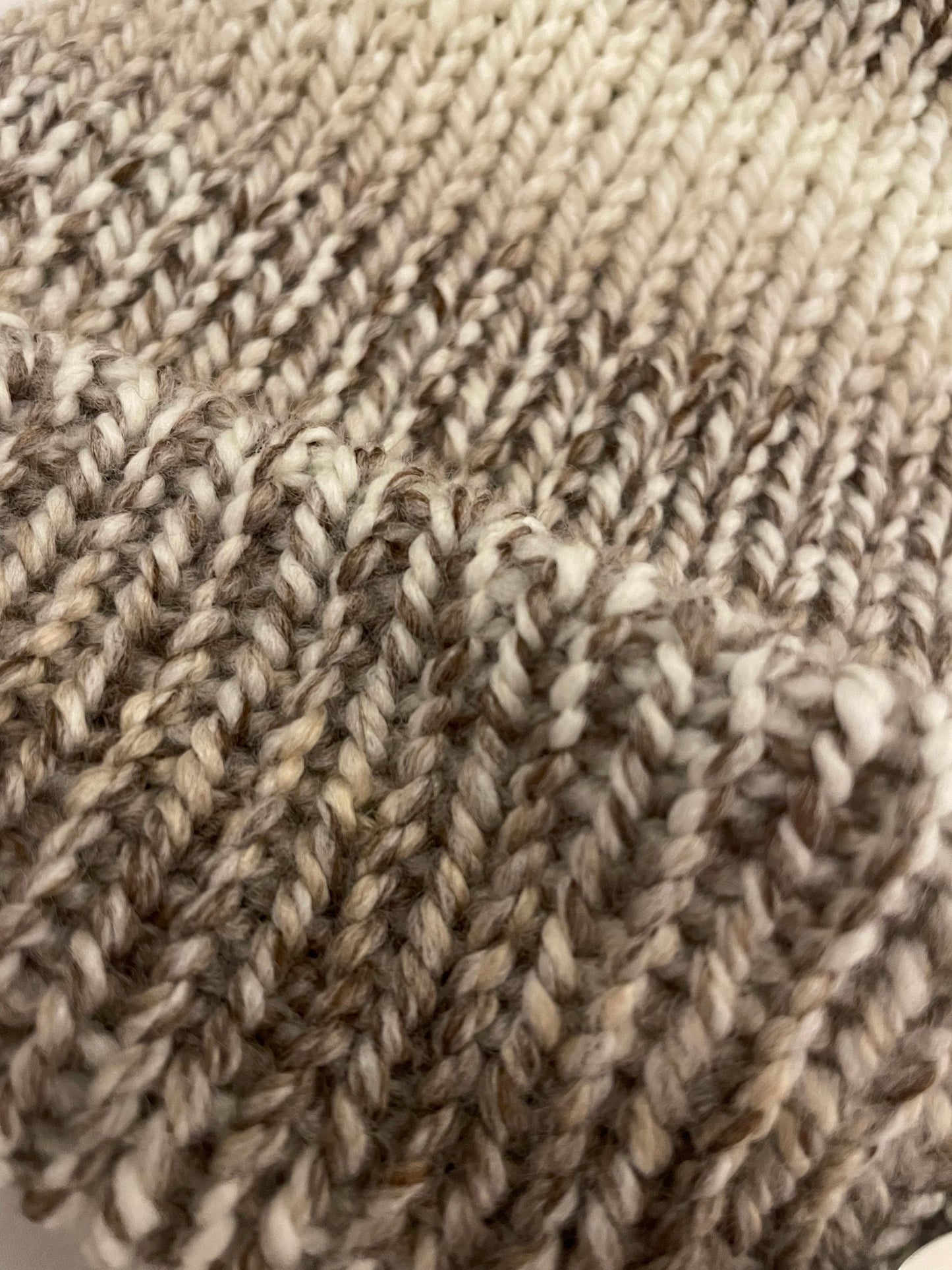 Close up of a knitted bobble hat